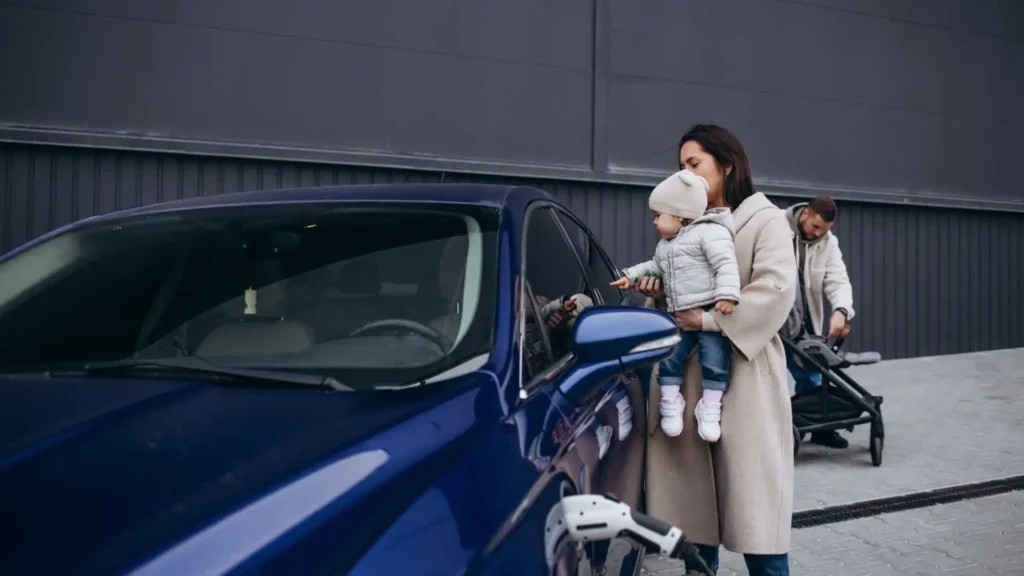 Average cost of car insurance in Arkansas showing mother and baby near car